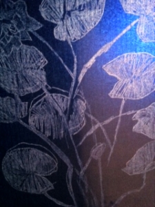carbon paper drawing inside window with artificial light behind